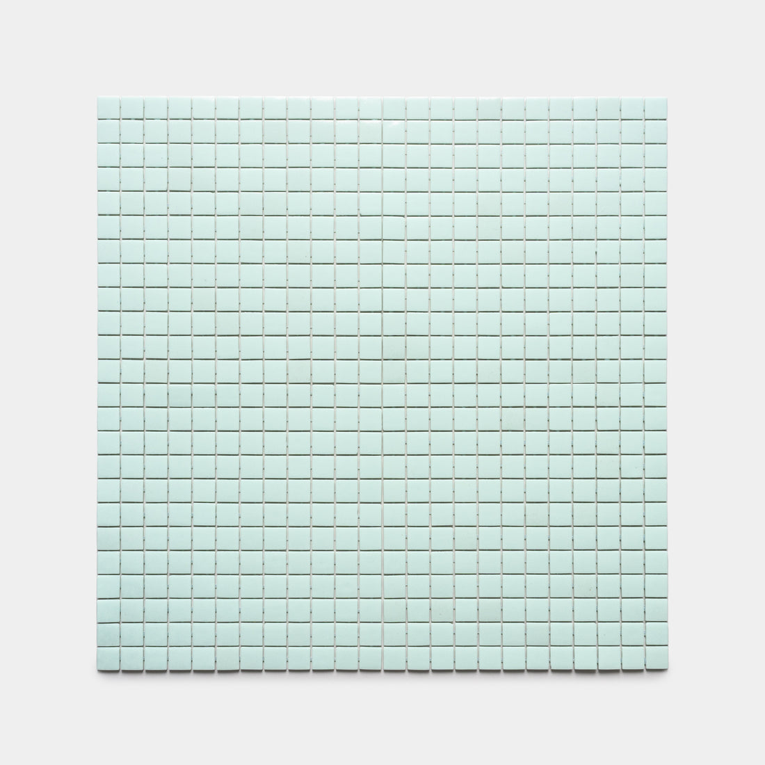 A square sheet of Piscine 1x1 small, light blue mosaic tiles by Zia Tile is arranged in a precise grid pattern on a plain white background.