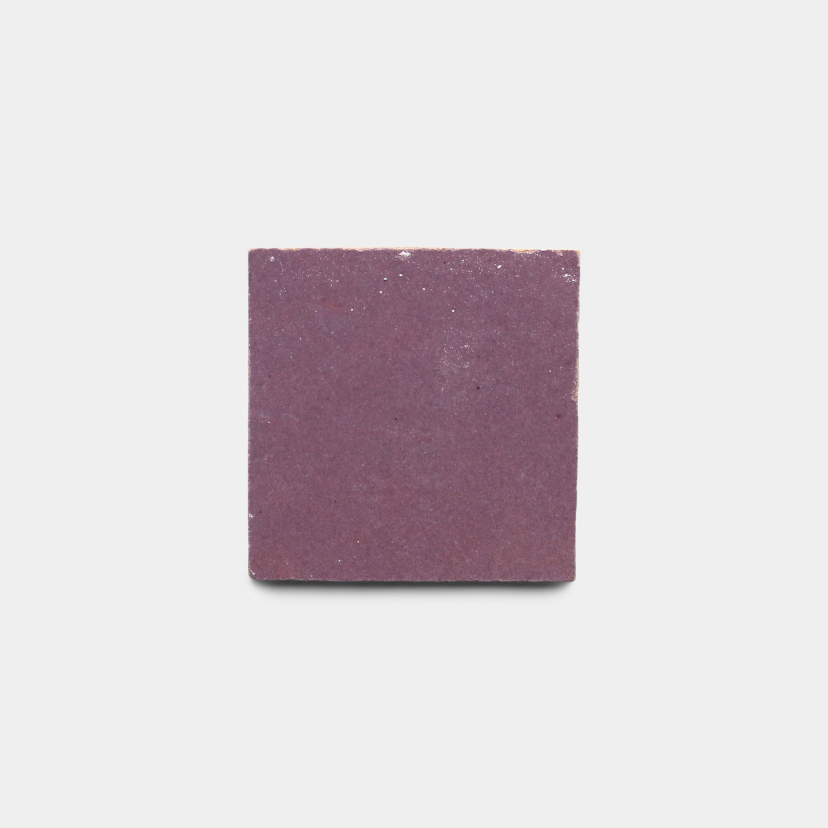 The Plum 2x2 sample by Zia Tile is a single square purple handmade tile with a slightly textured surface, shown against a plain white background.