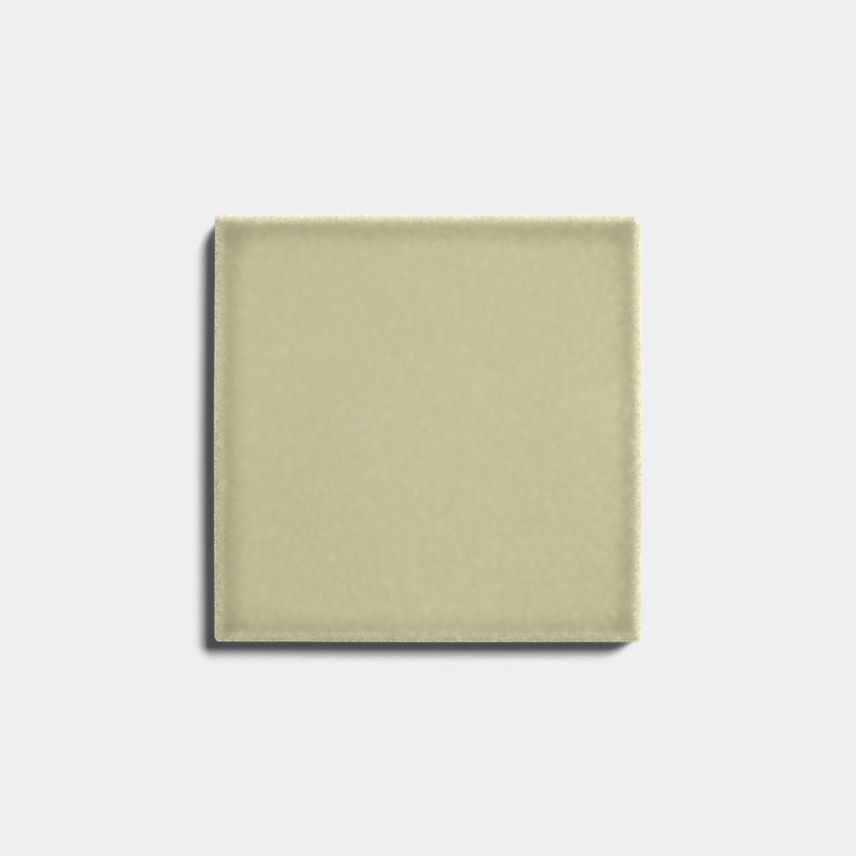 A single Ponderosa 4x4 ceramic tile by Zia Tile, light beige with a matte finish, is centered on a plain white background and casts a faint shadow to the lower left.