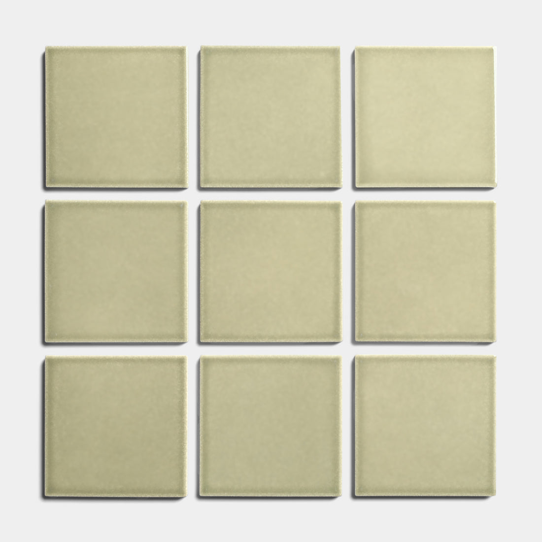 Nine Ponderosa 4x4 tiles from Zia Tile are arranged in a 3x3 grid on a white background, evenly spaced to showcase their beige glossy finish and architectural grade quality.