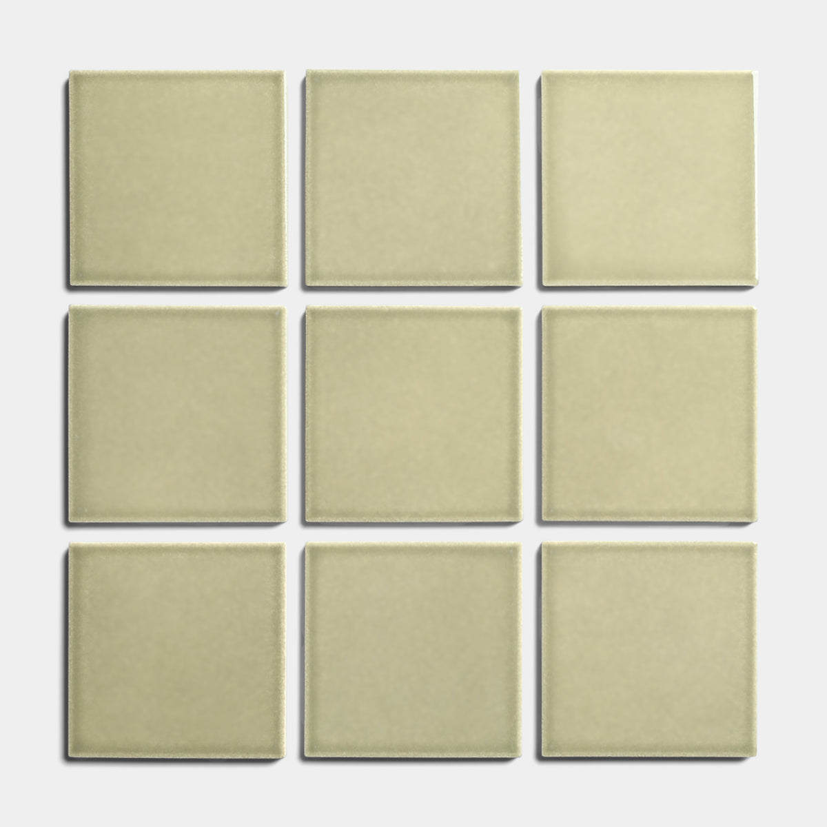 Nine Ponderosa 4x4 tiles from Zia Tile are arranged in a 3x3 grid on a white background, evenly spaced to showcase their beige glossy finish and architectural grade quality.
