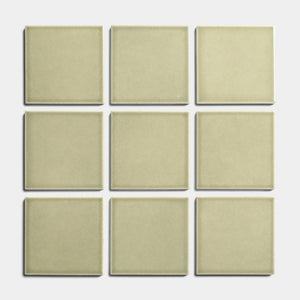 Nine Ponderosa 4x4 tiles from Zia Tile are arranged in a 3x3 grid on a white background, evenly spaced to showcase their beige glossy finish and architectural grade quality.