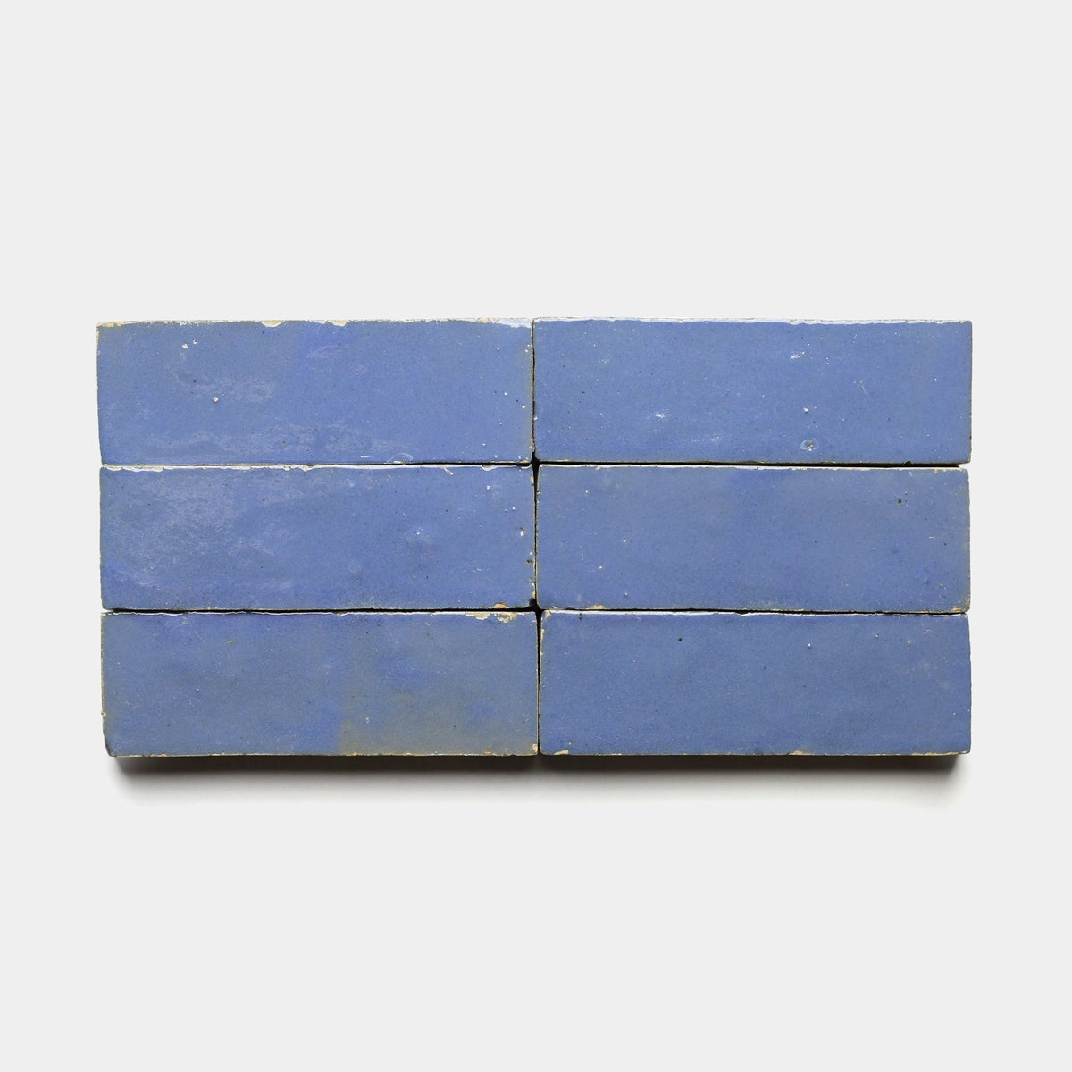 Six Zia Tile Portuguese Blue 2x6 samples are arranged in two rows of three against a plain white background.