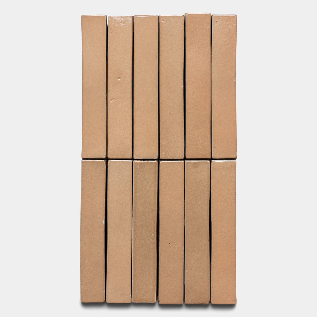 Twelve Posada Mini Bar tiles by Zia Tile are arranged upright in two neat rows of six against a plain white background.