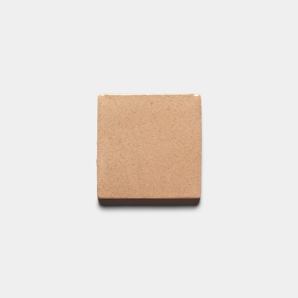 A single Posada 4x4 Square ceramic tile sample by Zia Tile is centered on a light gray background, casting a soft shadow.