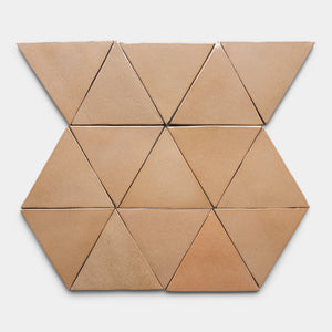 Nine Posada Triangle tiles from Zia Tile, in light brown ceramic, are arranged in a geometric pattern: three rows with triangles on the top and bottom and hexagons formed by adjoining triangles in the middle row.