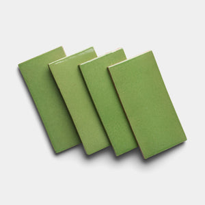 Four Primavera 4x8 Rectangle tiles by Zia Tile are arranged in a slightly overlapping, diagonal stack on a plain white background.