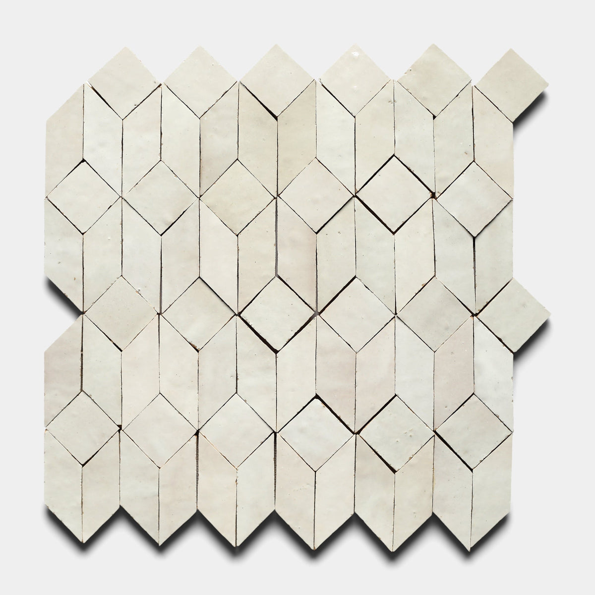 The Prismatic 1, Sample by Zia Tile is a white handmade tile with a stunning pattern, ideal for bringing elegance to any space.