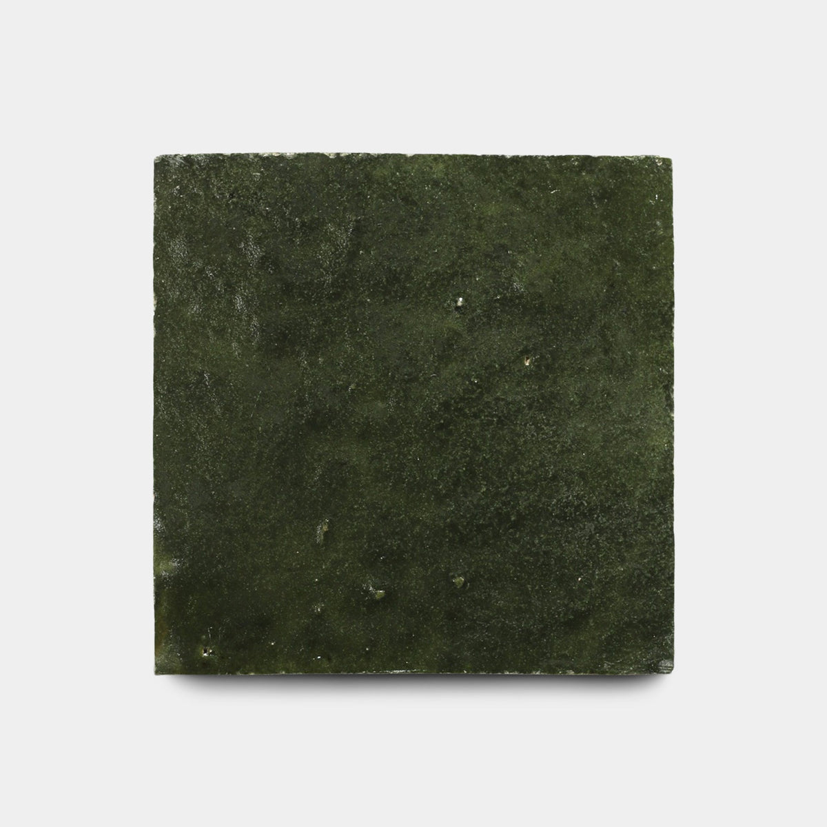 A single Noble Green 4x4 handmade tile by Zia Tile, square and dark green with a subtly textured, slightly uneven surface, is shown against a plain white background.