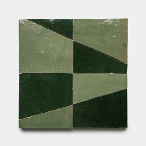 Atlas 4 by Zia Tile features four square tiles in a grid, each divided diagonally into dark and light green triangles, creating a geometric pattern on a white background.