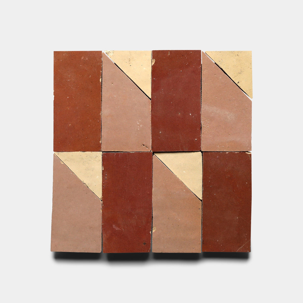 Six Radian Offset 3 samples by Zia Tile, arranged in two rows of three, each featuring a diagonal beige triangle in one corner to create a geometric, symmetrical pattern on a light gray background.