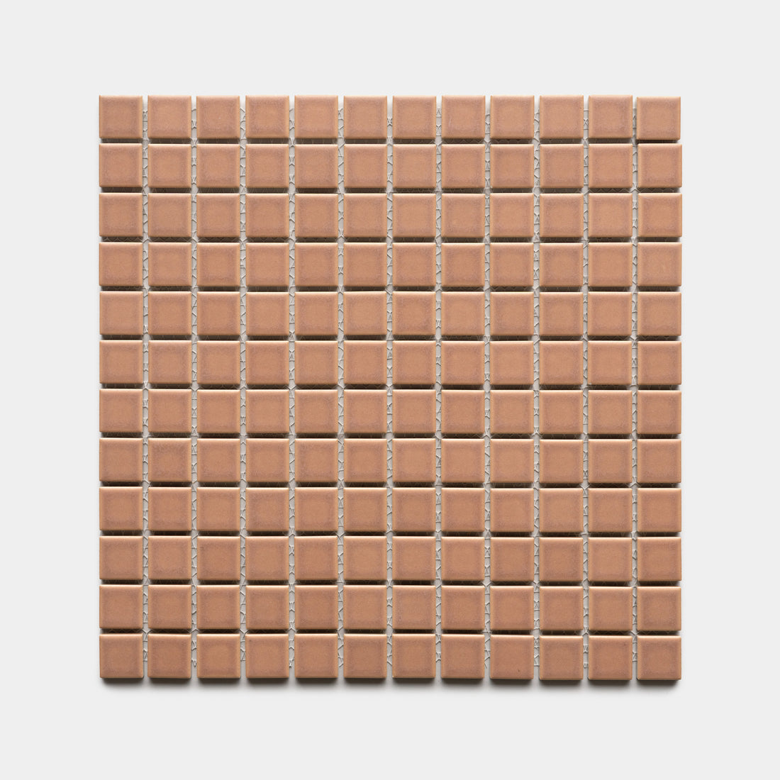 Zia Tile’s Rhubarb 1x1 features a square grid of small, evenly spaced, light brown ceramic tiles arranged in rows and columns on a white background.