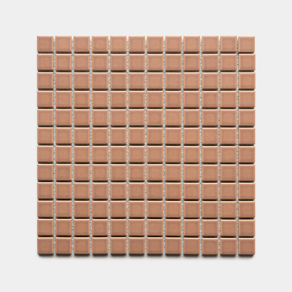 Zia Tile’s Rhubarb 1x1 features a square grid of small, evenly spaced, light brown ceramic tiles arranged in rows and columns on a white background.