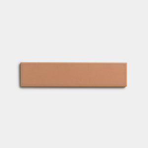 The Rhubarb 2x8 sample by Zia Tile, a rectangular tan tile, is centered on a plain white background.