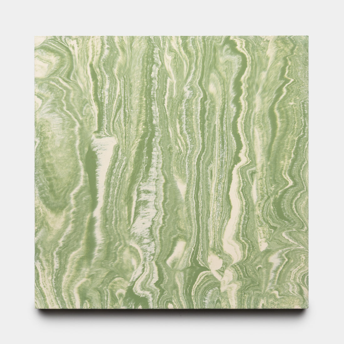 The River Olivine + Bone 8x8 by Zia Tile is a square panel featuring a marbled green and white pattern with organic swirls, resembling natural stone. Displayed against a plain white background.
