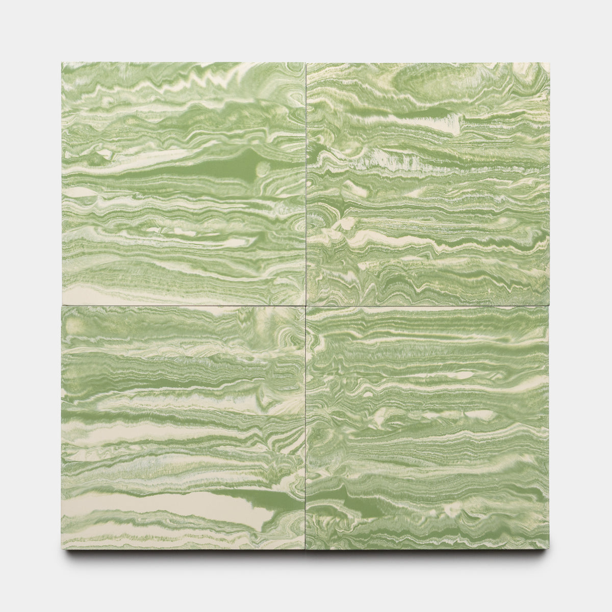 Four River Olivine + Bone 8x8 tiles by Zia Tile, arranged in a grid, display swirling green and white marbled patterns reminiscent of natural stone or abstract art.