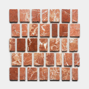 Thirty-five Scarpa in Rosso Alicante tiles by Zia Tile, featuring reddish-brown tones and white marble veining, are arranged in a 5x7 grid on a white background.