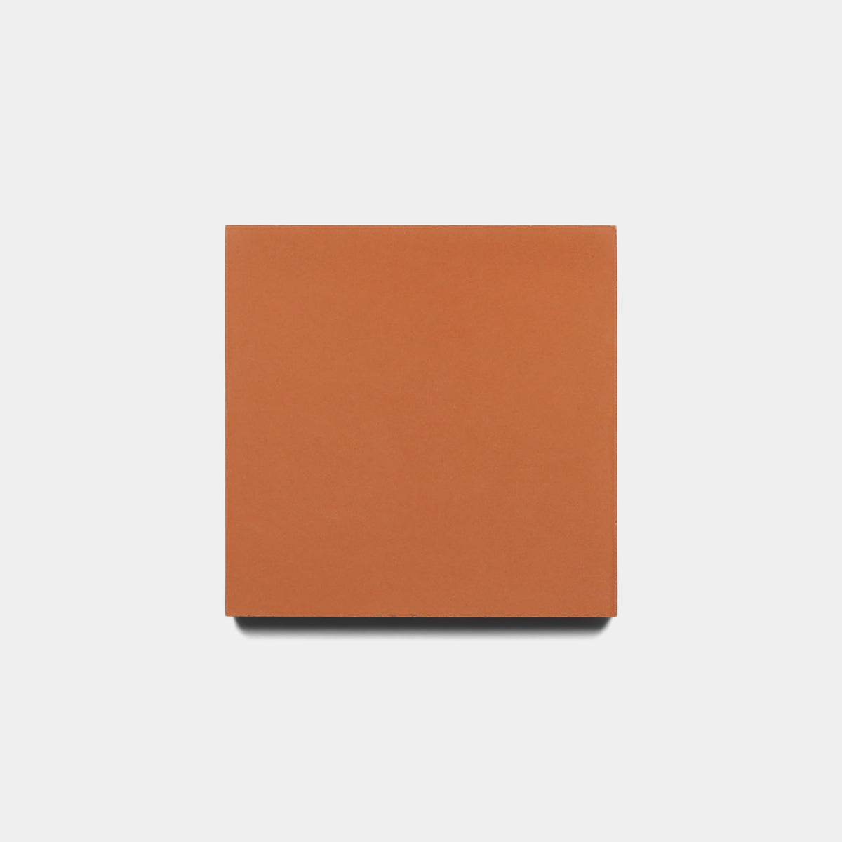 A solid terracotta orange, square Rust 4x4 sample from Zia Tile is shown against a white background.