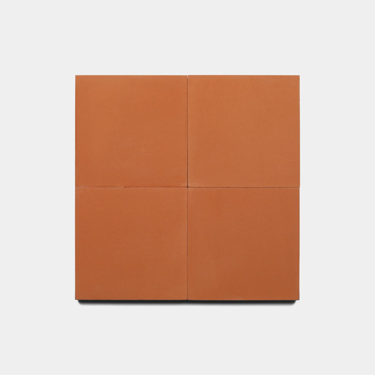Four Zia Tile Rust 4x4 samples are arranged in a 2x2 grid against a plain white background.