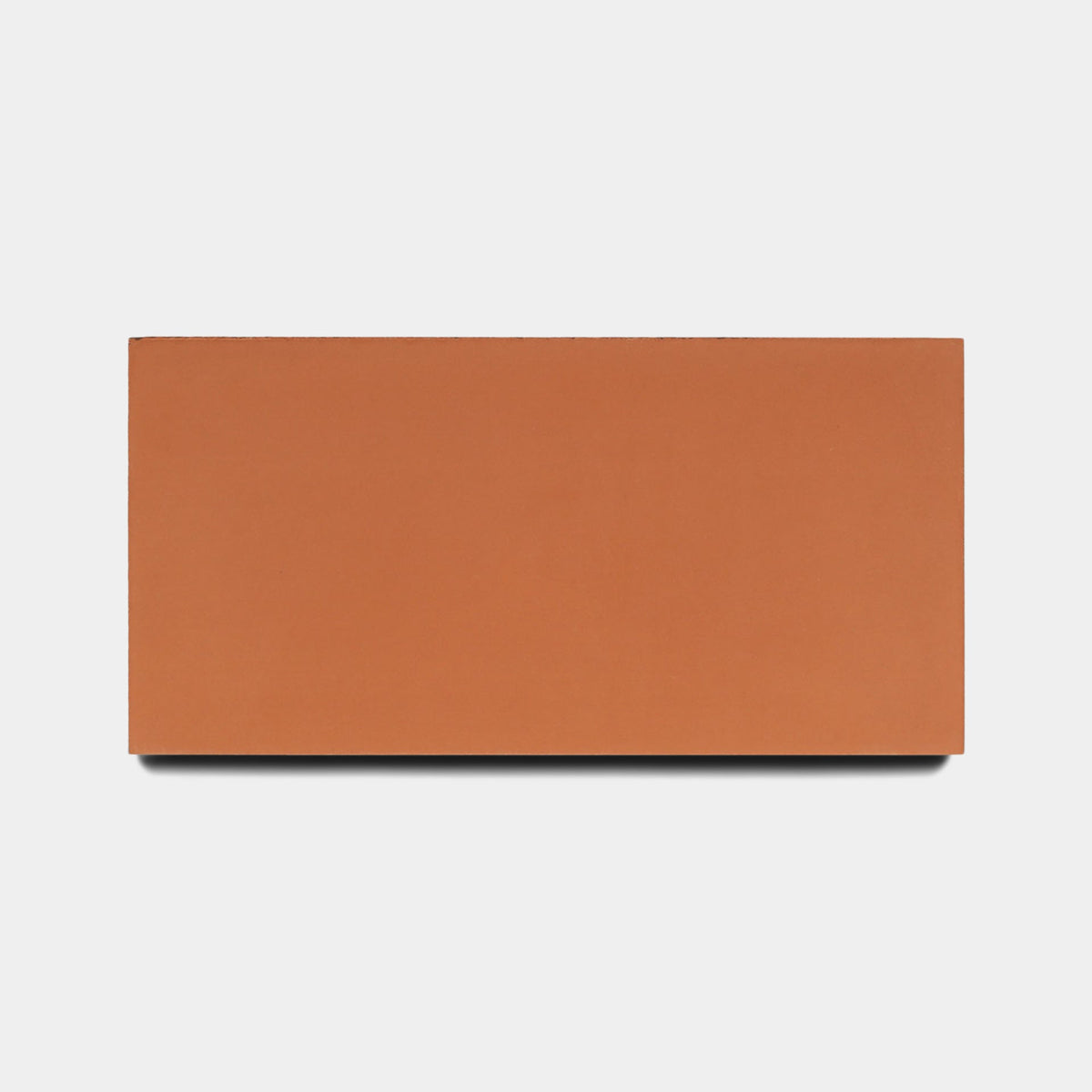 A rectangular Rust 4x8 tile sample by Zia Tile is centered on a plain white background, casting a faint shadow below.