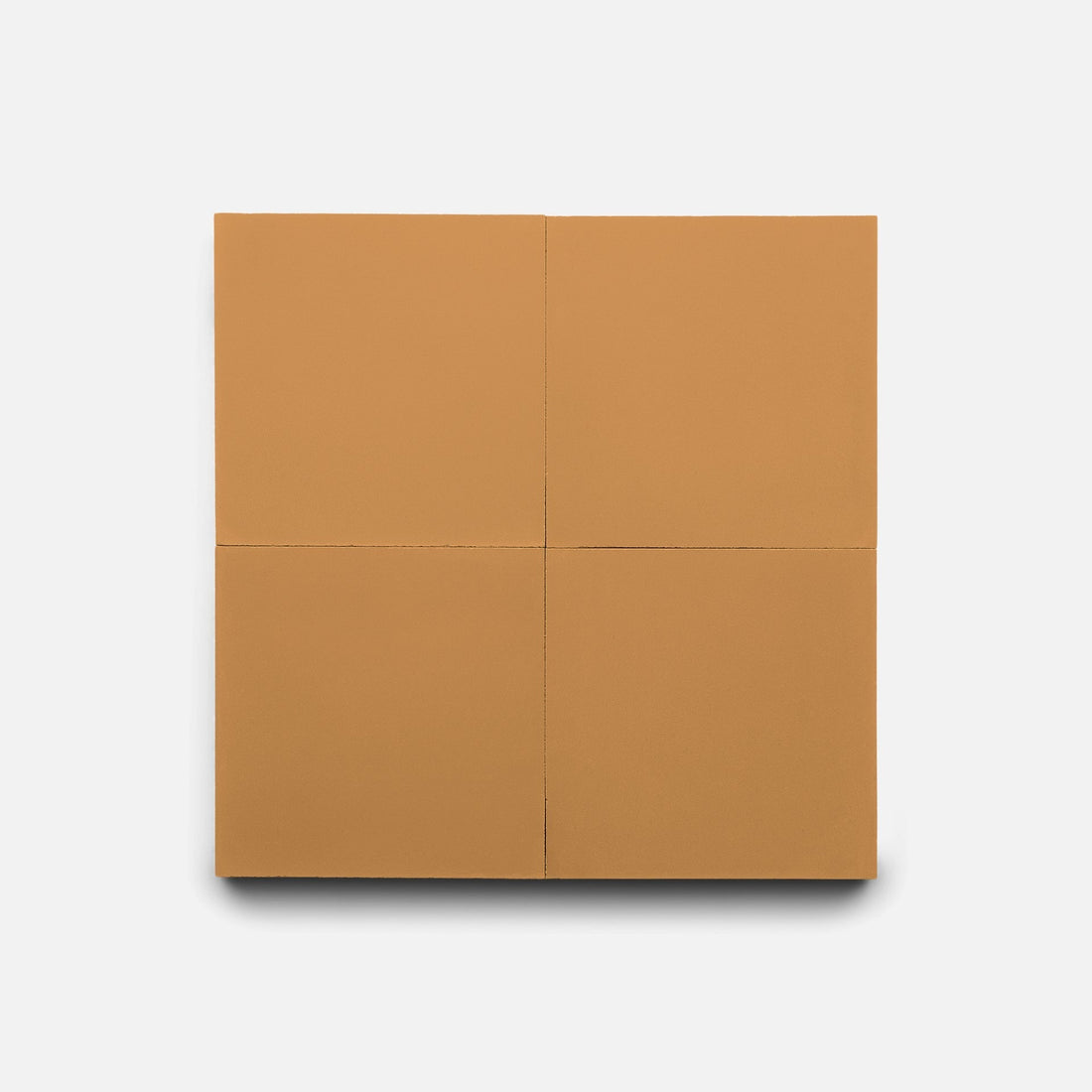 Zia Tile's Saddle 4x4 features four equal, tan handmade tiles arranged in a 2x2 square on a white background, with subtle shadows beneath suggesting depth.