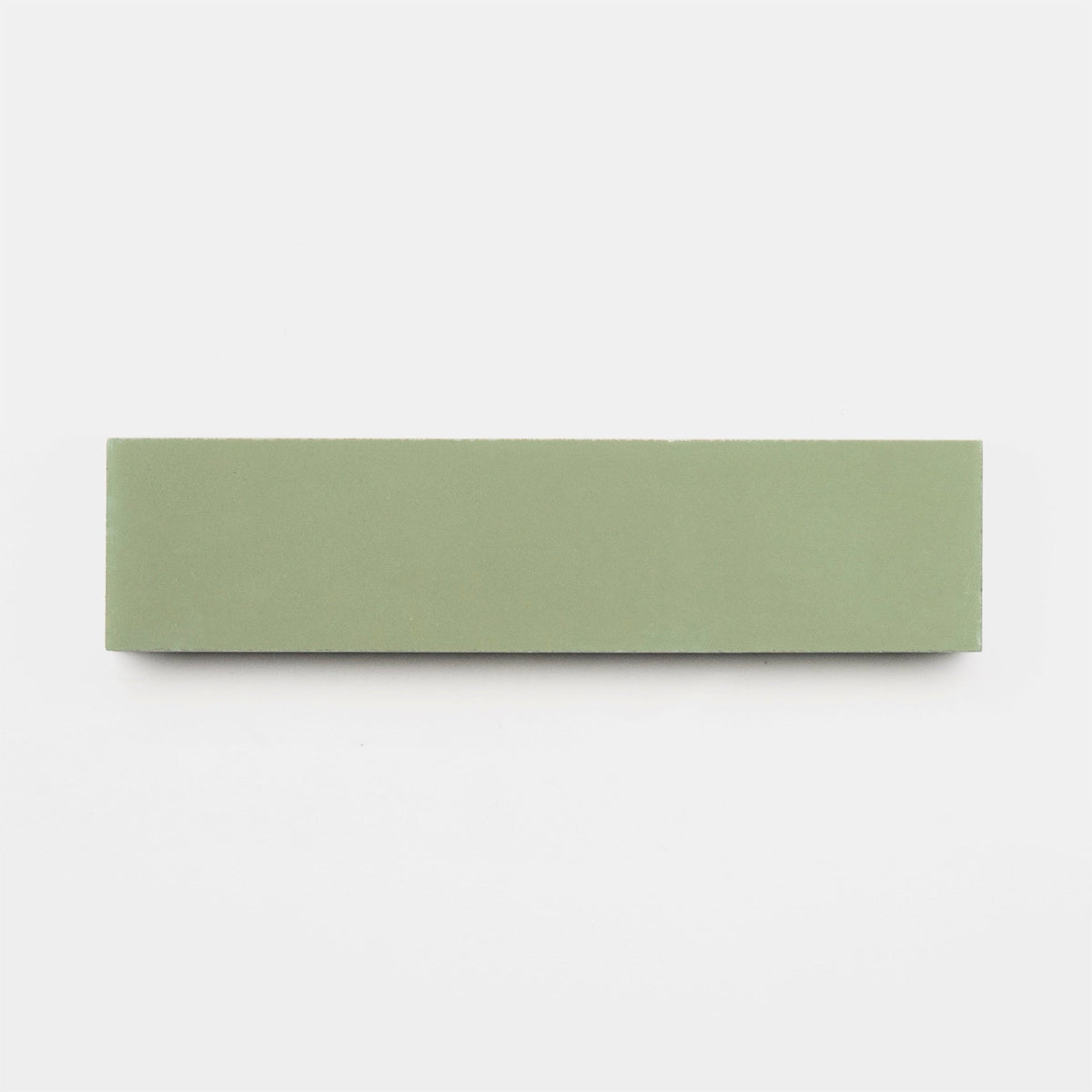 A rectangular, flat green tile—Nagano 2x8 Sample by Zia Tile—is shown on a plain white background.
