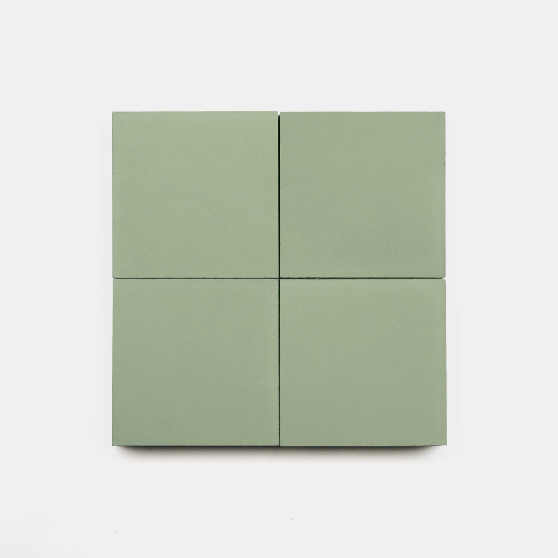 Four Saguaro 4x4 handmade tiles by vendor-unknown, in light green, are arranged in a 2x2 grid on a plain white background.
