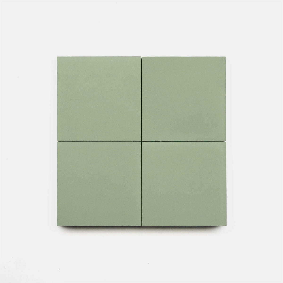 Four Saguaro 4x4 handmade tiles by vendor-unknown, in light green, are arranged in a 2x2 grid on a plain white background.