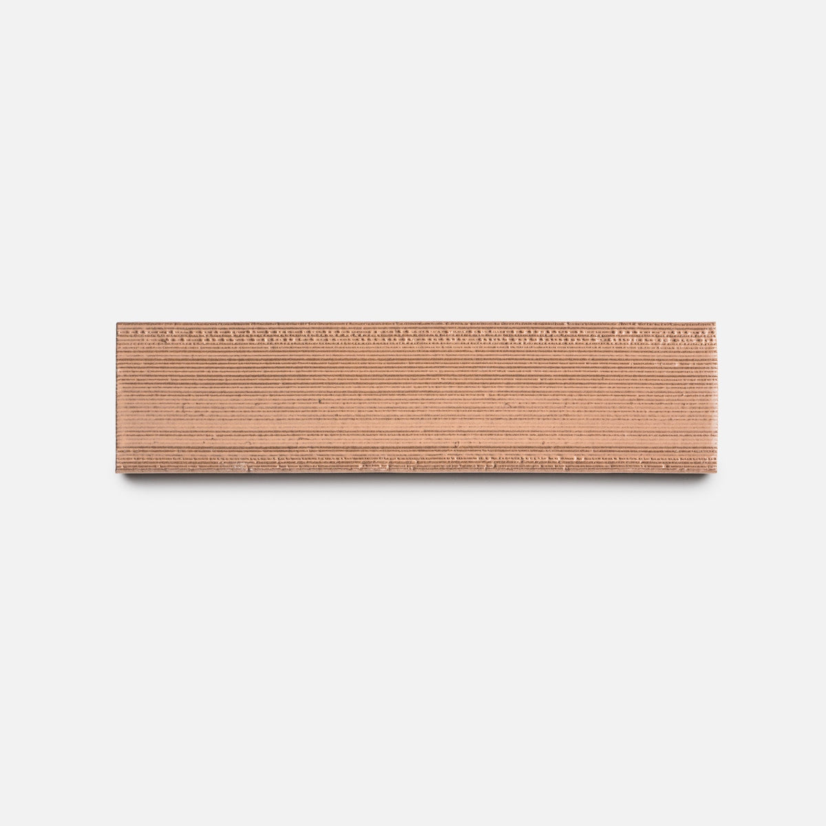A sample of Sakura + Etched by Zia Tile is displayed horizontally against a plain white background, with its ridged edge facing outward.