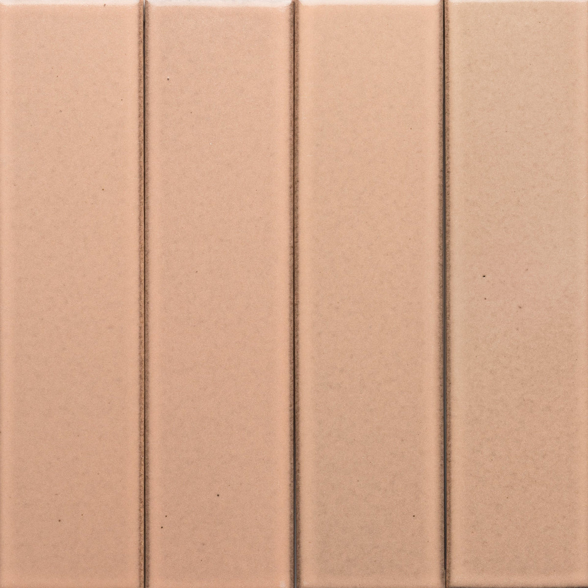 Four vertical, evenly spaced Sakura + Flat tiles by Zia Tile, in a muted pinkish-beige with subtle texture and narrow grout lines.