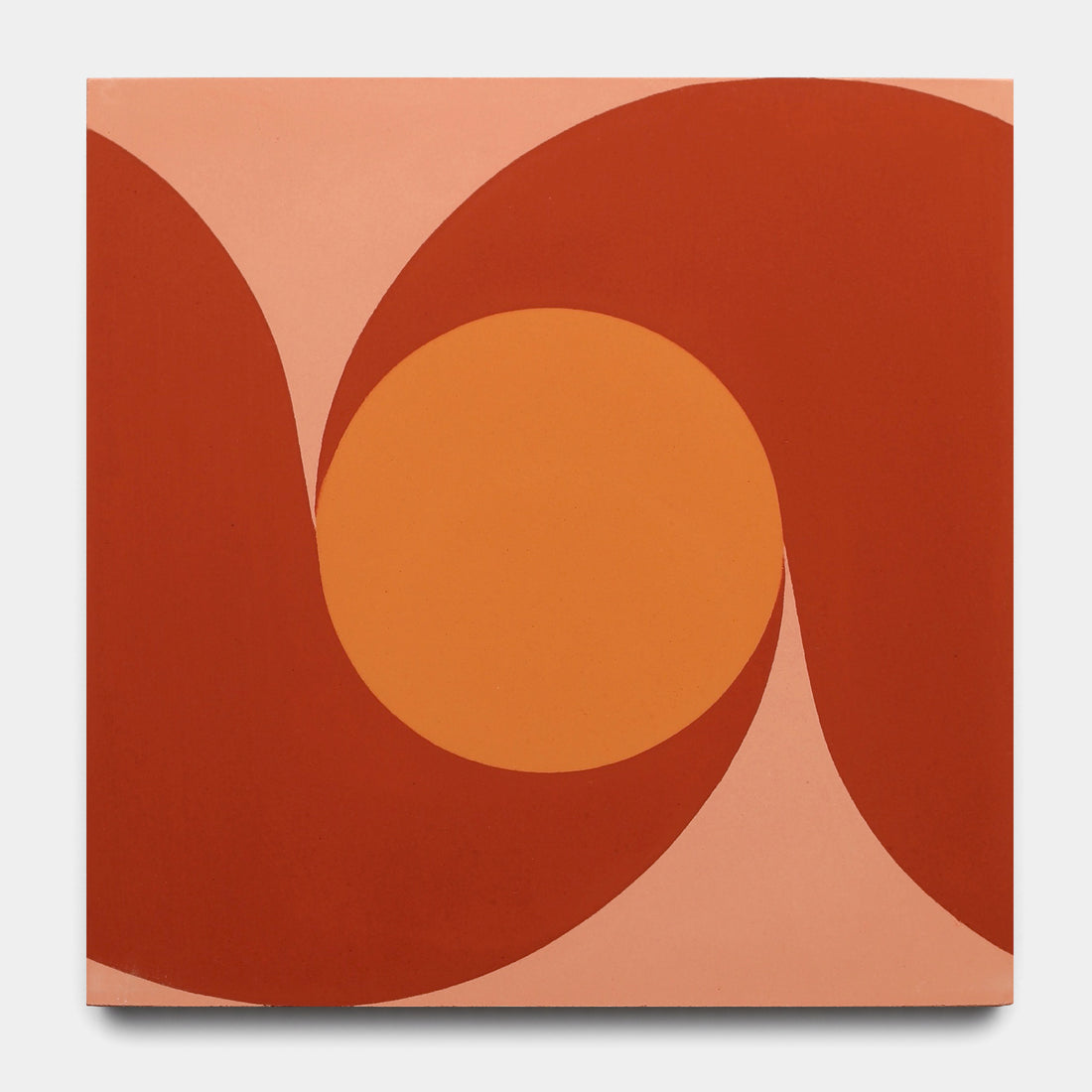 The San Juan Delta Moon 8x8 by Zia Tile features abstract art with a large orange circle centered on a square, surrounded by wavy red and peach forms, evoking vibrant San Juan cement tiles on a soft pink backdrop.