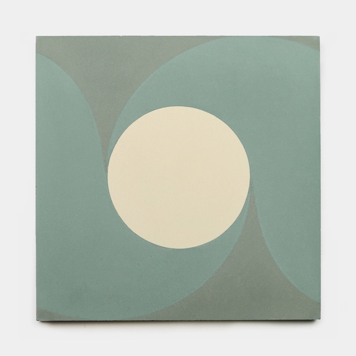 San Juan Zeppelin 8x8 by Zia Tile is a square cement tile with a large cream circle and curved teal shapes on a light gray background—ideal for modern spaces. Order your sample today at Zia Tile.