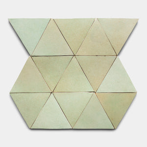Nine light green Sayulita Triangle tiles by Zia Tile, arranged in two rows of four and one row of three triangles, form a geometric hexagonal pattern on a white background.