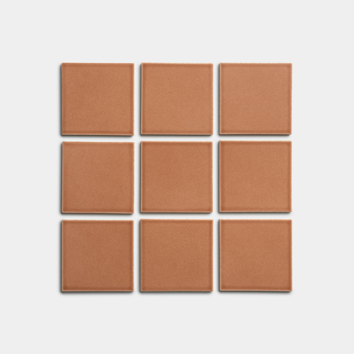 Nine Sepia 4x4 tiles by Zia Tile, featuring a brown tone and arranged in a three-by-three grid on a plain white background.