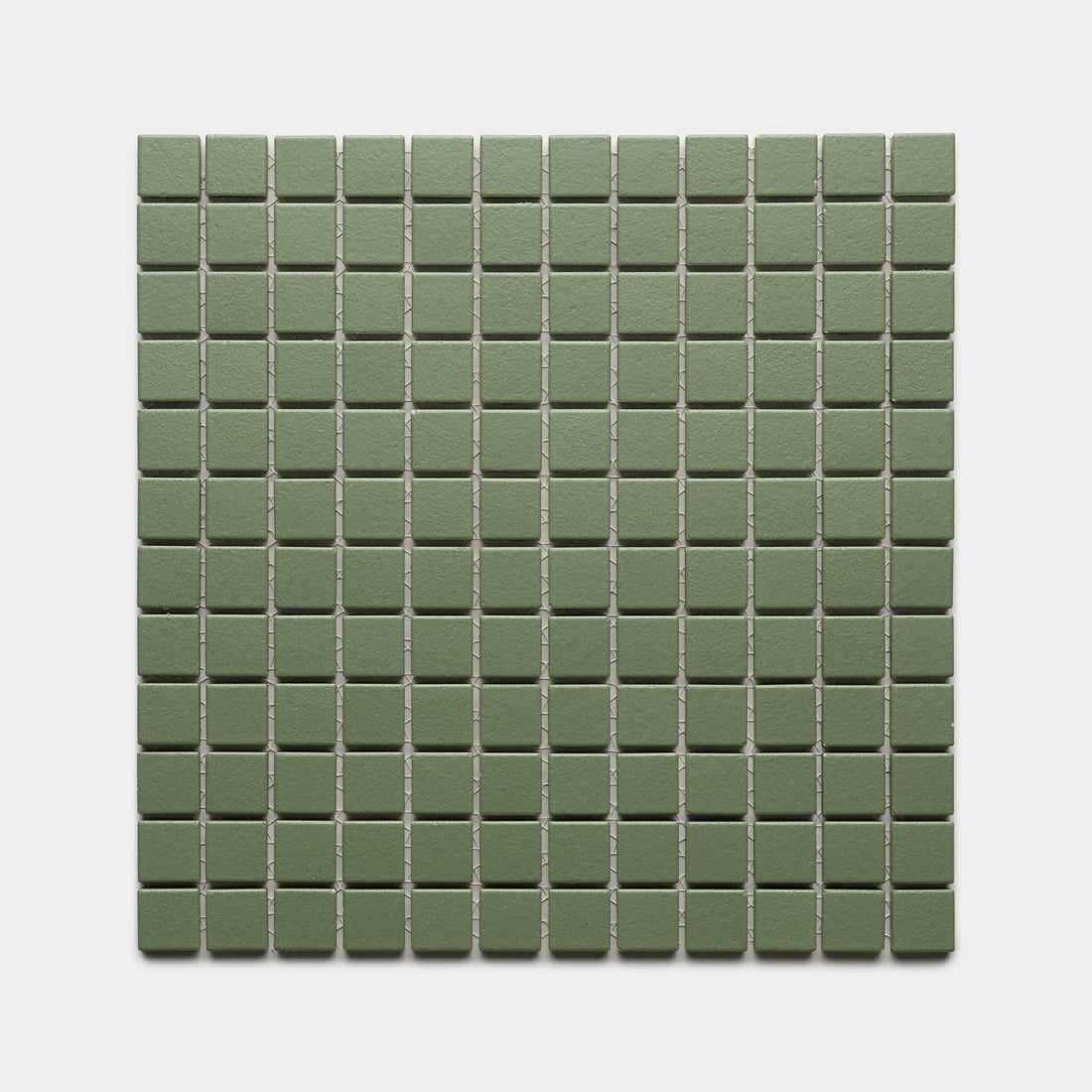 Sequoia 1x1 by Zia Tile features small, square, matte green tiles arranged in an even grid of rows and columns on a light gray background.