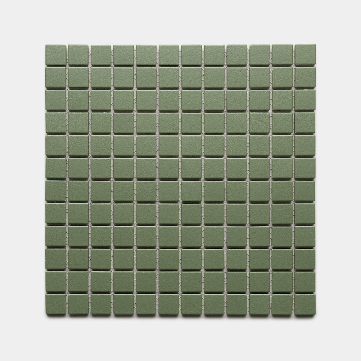 Sequoia 1x1 by Zia Tile features small, square, matte green tiles arranged in an even grid of rows and columns on a light gray background.
