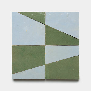 Atlas 3 by Zia Tile features four square tiles in a grid, each split diagonally into green and light blue triangles, creating an alternating geometric pattern on a crisp white background.