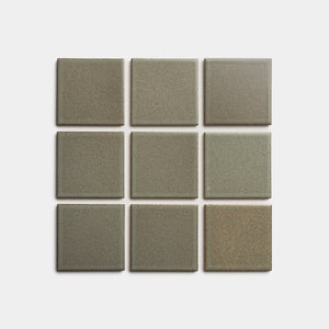 Nine Spanish Moss 4x4 ceramic tiles by Zia Tile, olive-green with a matte finish and subtle tonal variations, are arranged in a 3x3 grid on a plain white background.