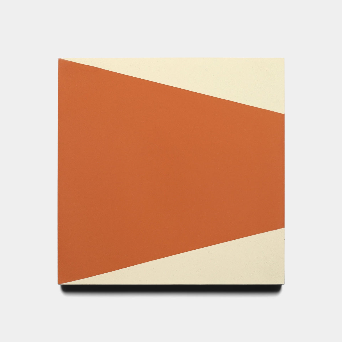 The Sparrow Rust 8x8 Sample by Zia Tile showcases a bold geometric Sparrow Rust shape set diagonally on a cream square, offering a striking, dynamic color contrast.