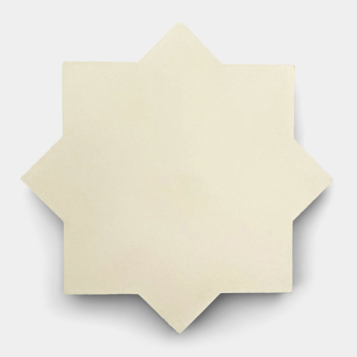 The Stars & Cross Bone by vendor-unknown features an off-white, eight-pointed star-shaped tile set against a plain white background, casting a faint shadow—an elegant example of the classic Stars & Cross pattern.