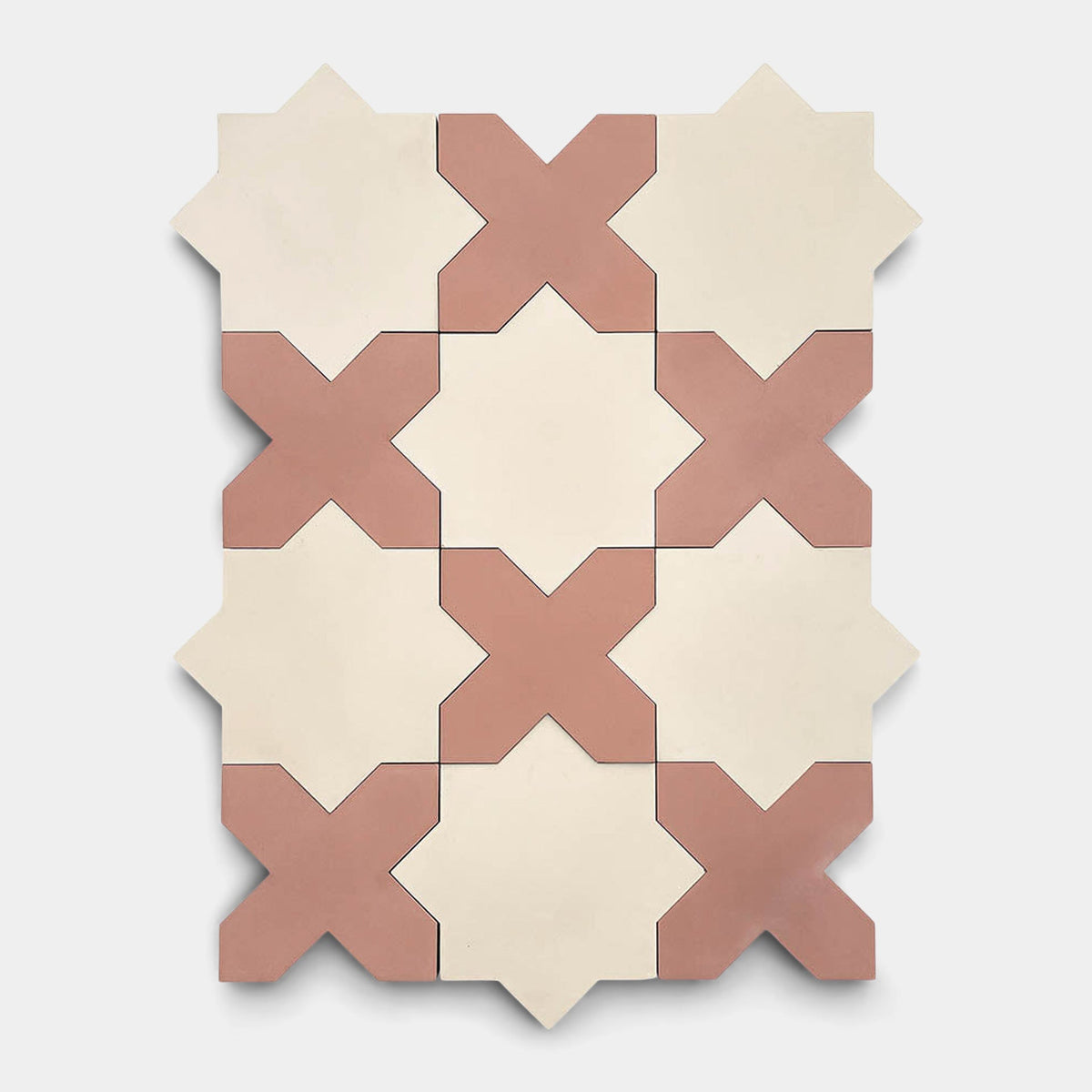 The Stars & Cross + Oscura sample from Zia Tile features alternating cream star and terracotta X-shaped handmade tiles arranged in a geometric pattern on a light gray background, inspired by classic Zia Tile designs.