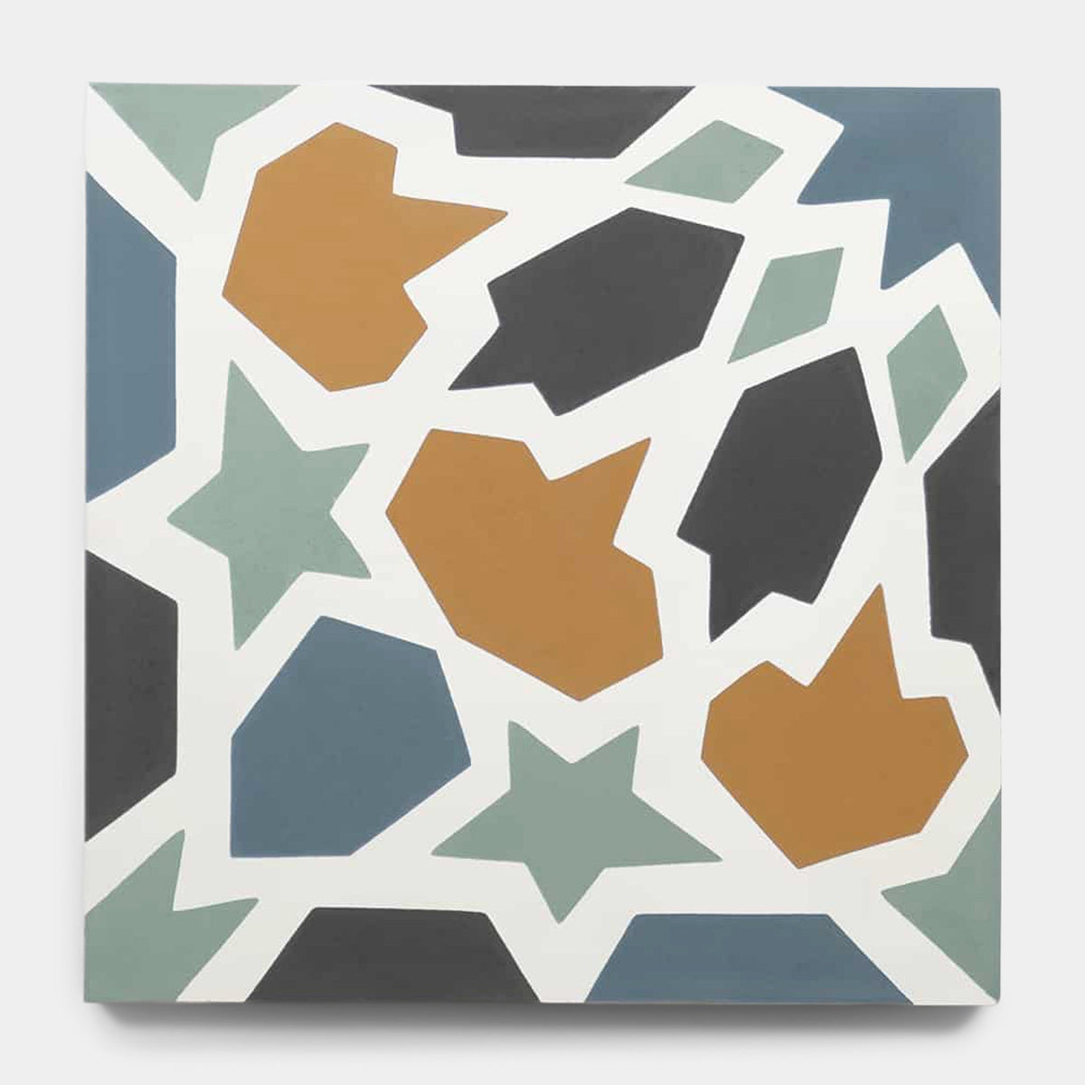 The Tangier 8x8 sample by vendor-unknown showcases an abstract geometric design with mustard yellow, black, and sage green shapes and stars outlined in white on a light gray background.