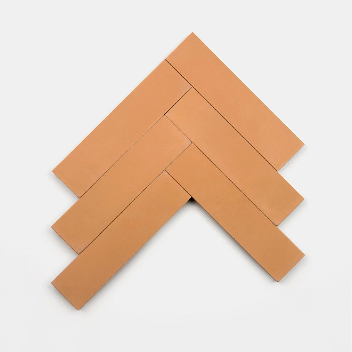 Five Terra Cotta 2x8 cement tiles by vendor-unknown are arranged in a herringbone pattern on a white background, forming an upward-pointing arrow.