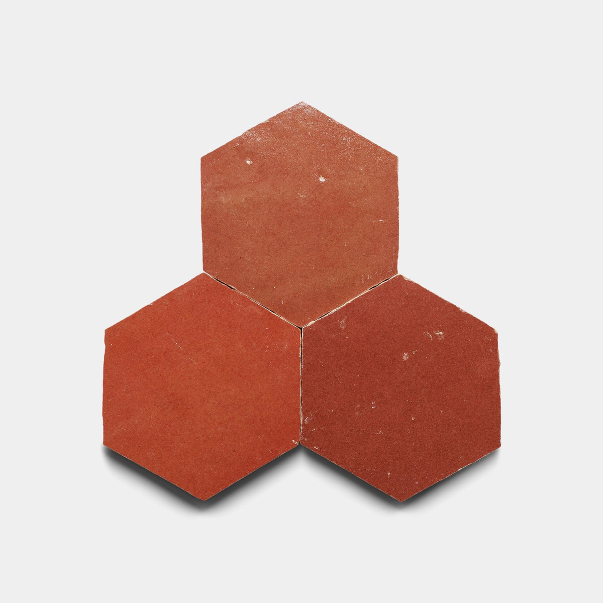A close-up of the Terra Rosa 2x2 sample from Zia Tile, highlighting the intricate details of this handmade cement tile.