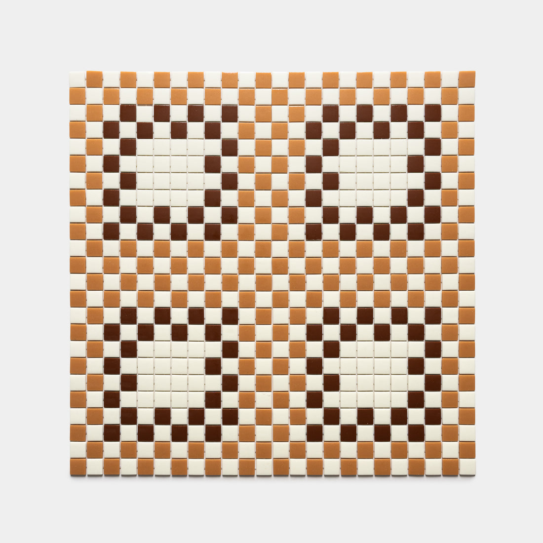 The Tesserae Milk + Camel + Umber tile by Zia Tile features a checkered grid in brown, tan, and white with four large white circles outlined in brown, set on a tan and brown checkered background.