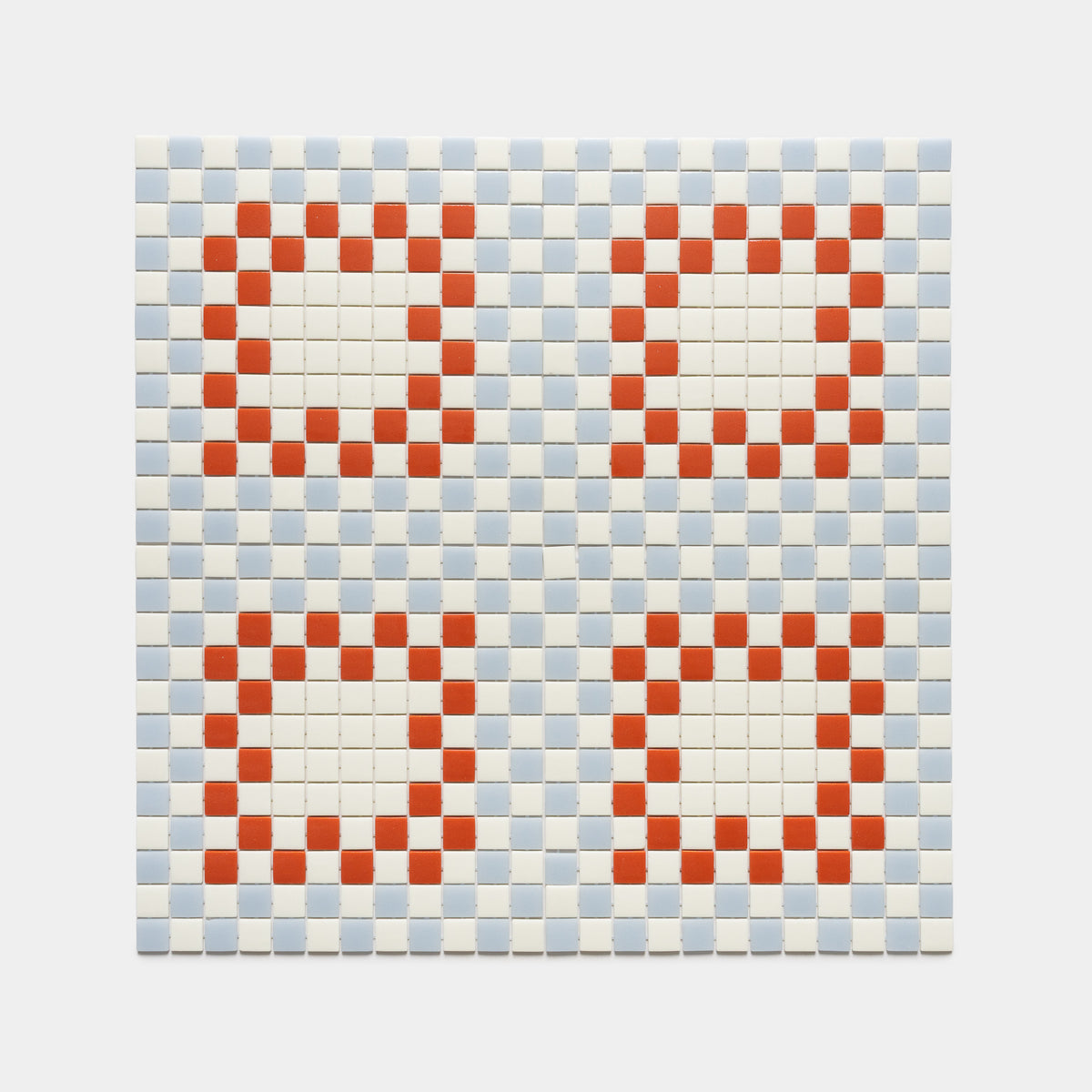 The Tesserae Milk + Tranquil Blue + Roma tile by Zia Tile features a checkerboard pattern with four red-bordered white squares set on a light blue and white background.