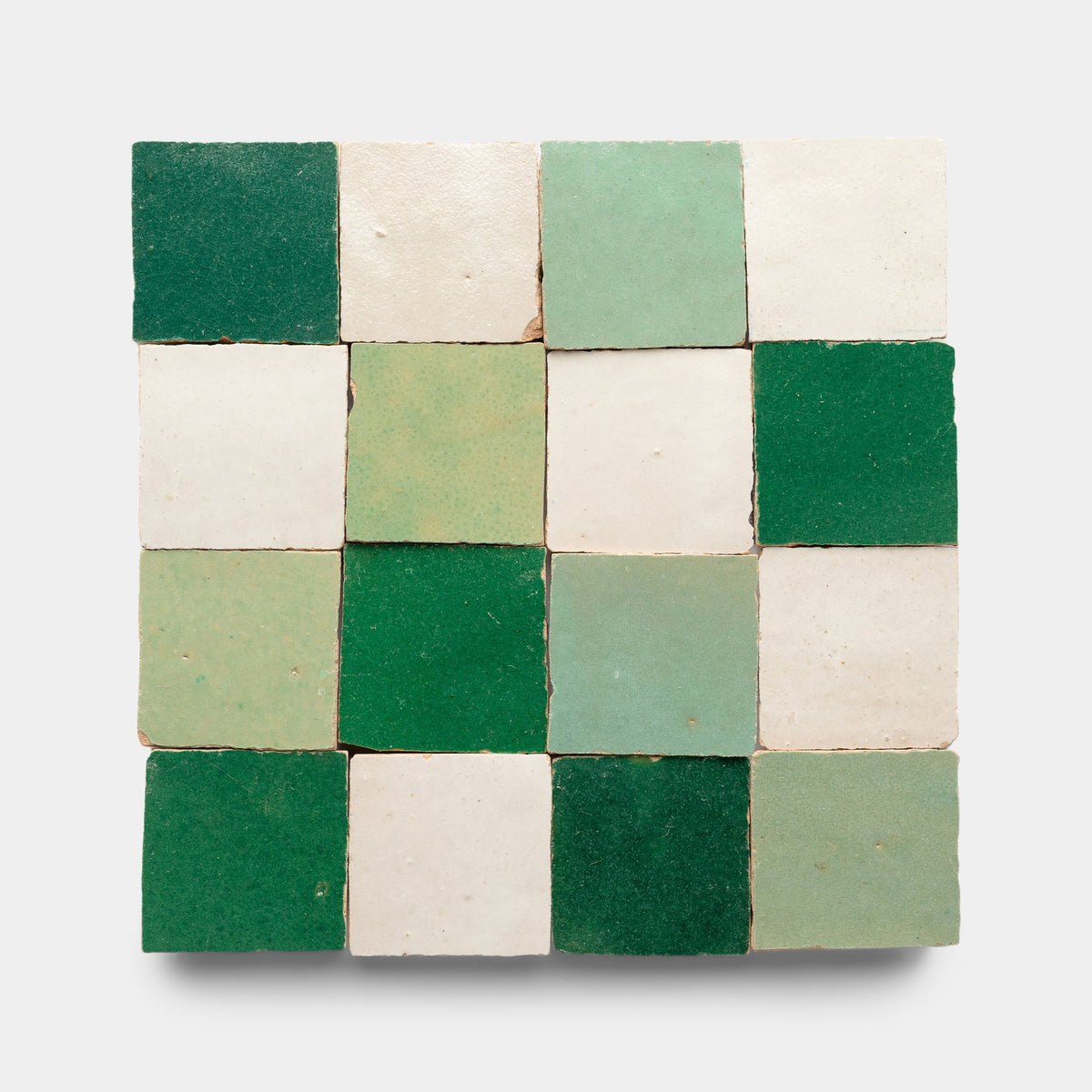 The Tidepool + Casablanca + Jade Checkerboard Sample by Zia Tile features handmade tiles in green, light green, and white, arranged in a 4x4 square pattern on a plain background.