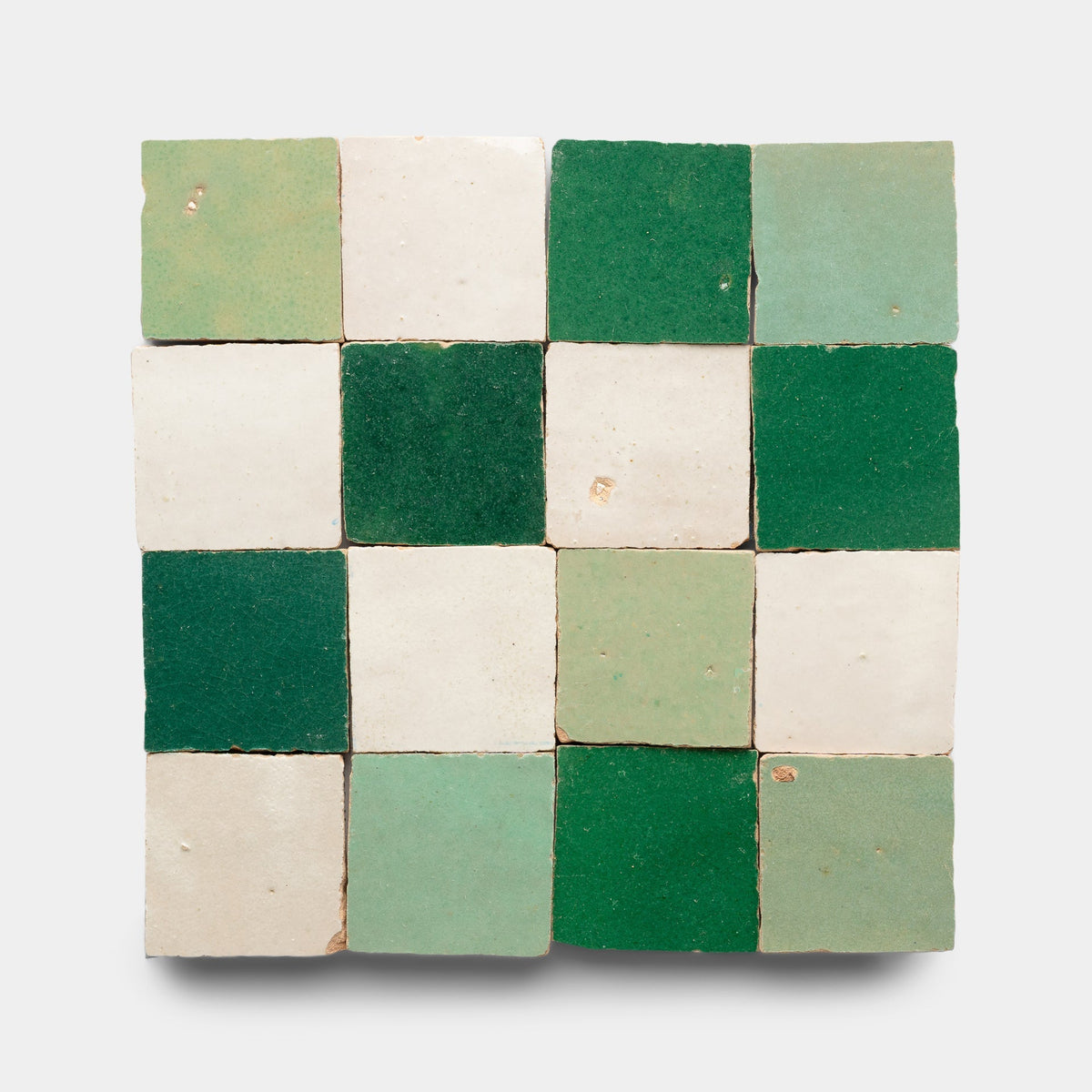 The Zia Tile Tidepool + Casablanca + Jade Checkerboard Sample features sixteen handmade tiles in alternating green and white shades, arranged in a checkerboard pattern on a light background.