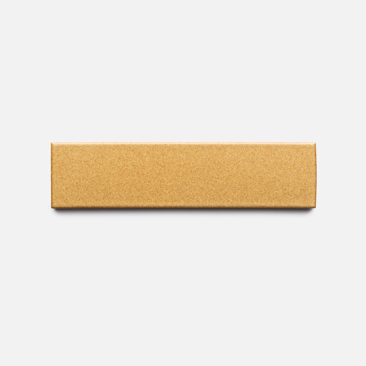 A rectangular, plain brown cardboard box labeled “Toast + Flat, Sample” from Zia Tile is centered on a light gray background. The closed box has no other visible markings or labels.