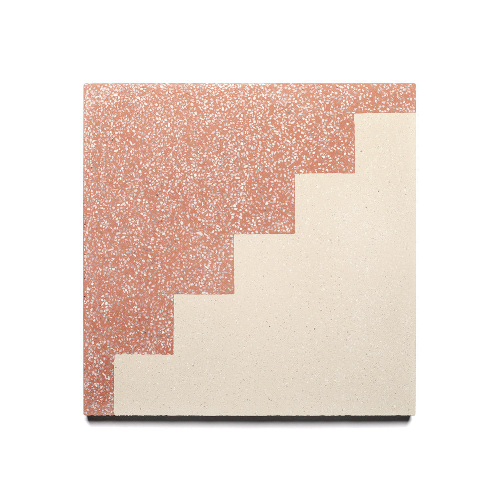 The Trellick Pompeii 12x12 sample from Zia Tile is a square cement tile with a terrazzo pattern, featuring red speckles and cream sections divided by a stair-step design for unique handmade character.